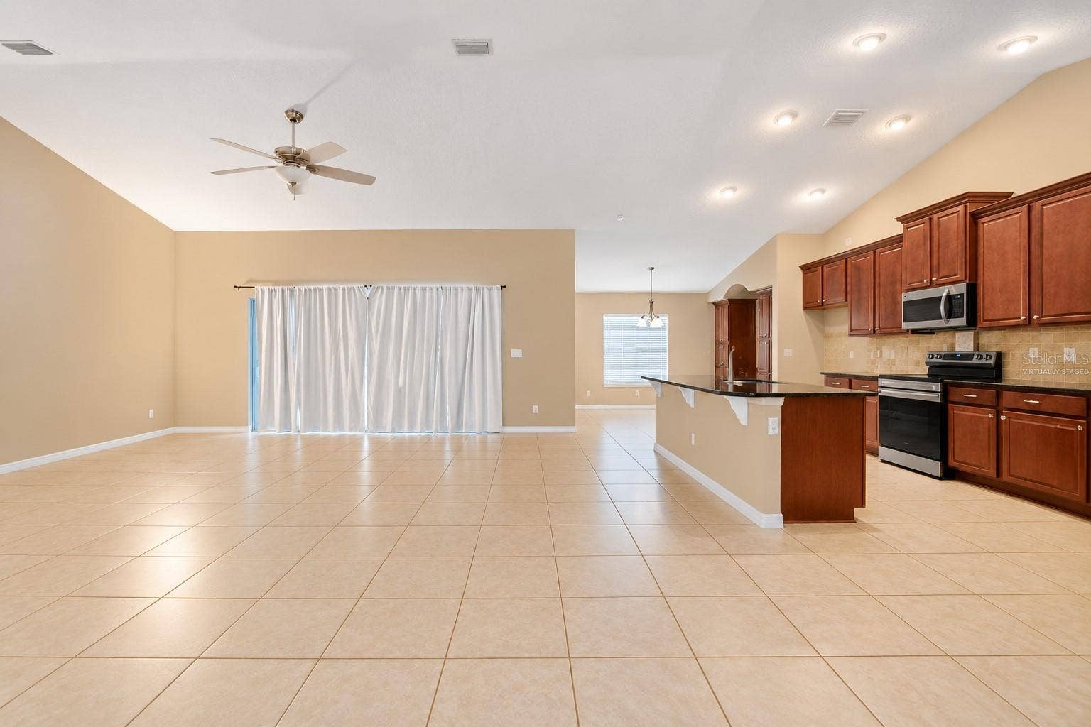 42 BECKNER LANE, Palm Coast, FL 32137 MAIN AND KITCHEN- VIRTUALLY STAGED