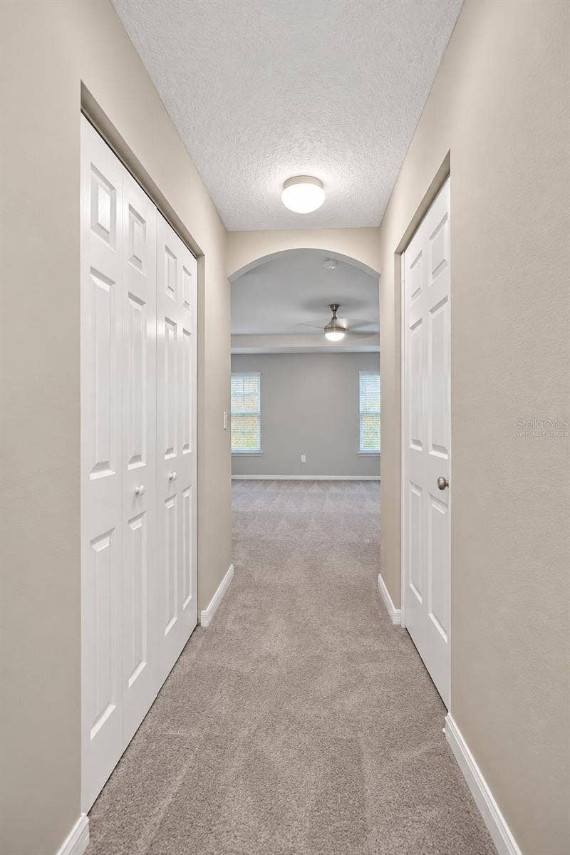 42 BECKNER LANE, Palm Coast, FL 32137 MASTER BEDROOM HALL- VIRTUALLY STAGED