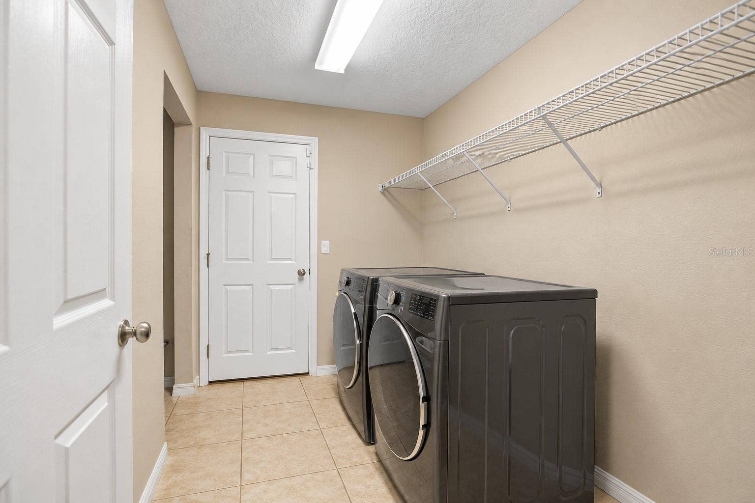 42 BECKNER LANE, Palm Coast, FL 32137 LAUNDRY ROOM- VIRTUALL STAGGED