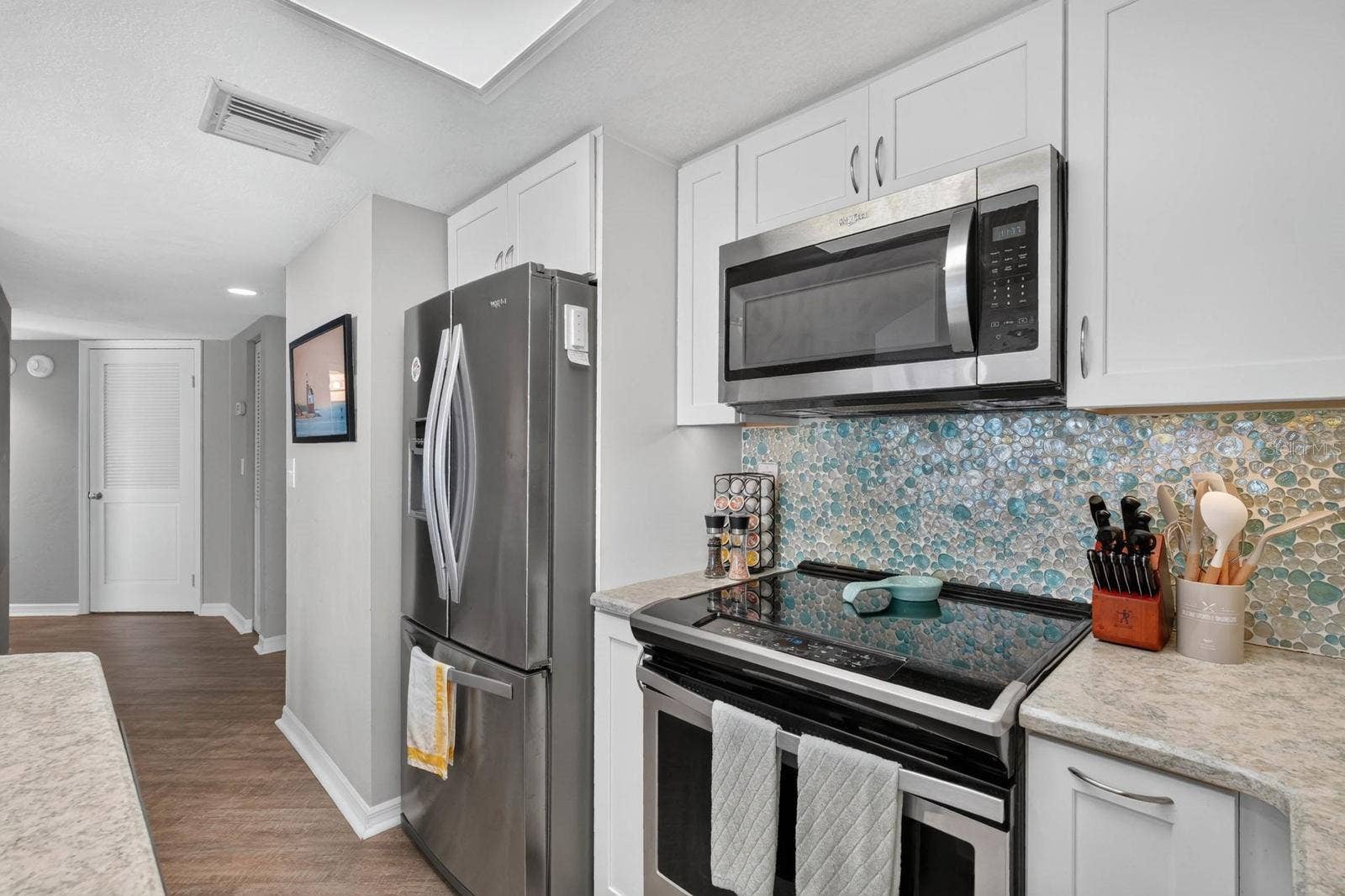 3023 S ATLANTIC AVENUE, #1106, Daytona Beach Shores, FL 32118 Kitchen Facing Hallway