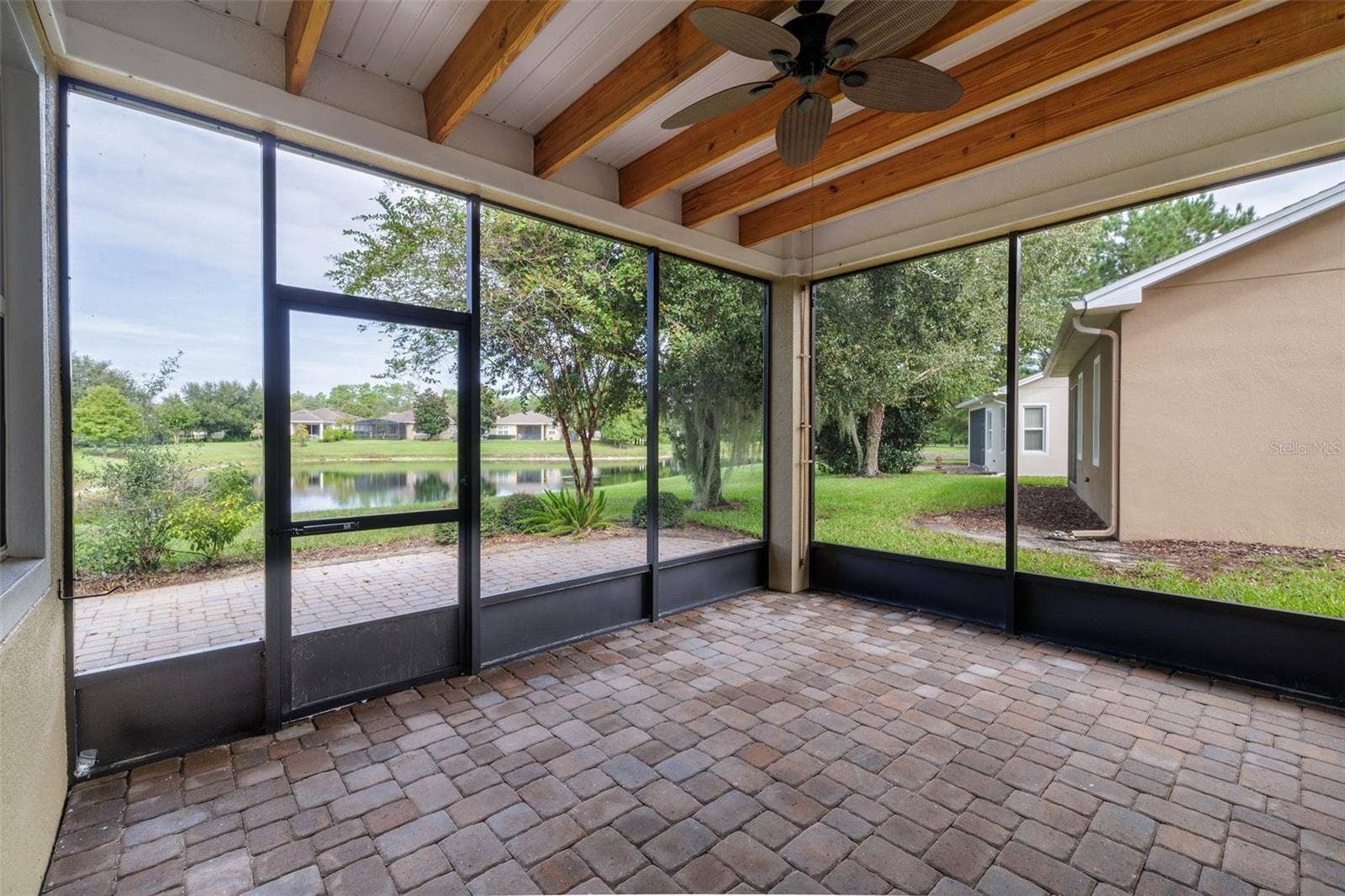 413 CYPRESS HILLS WAY, Deland, FL 32724 Water view / Screened Lanai