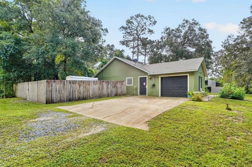 1580 DELAND AVENUE, Orange City, FL 32763 Side Profile and Driveway