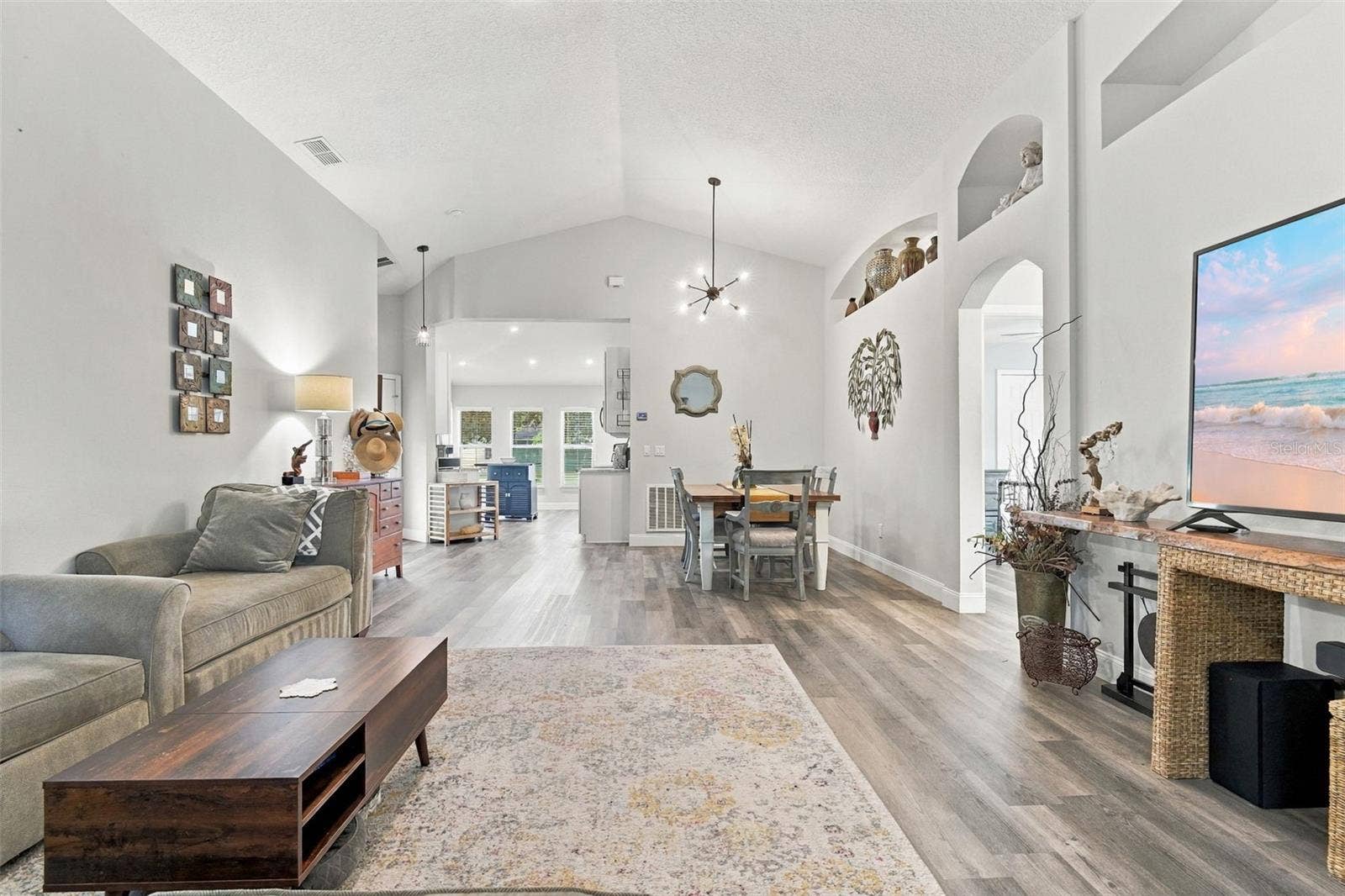 Main living area towards dining area. These ceilings are so nice!