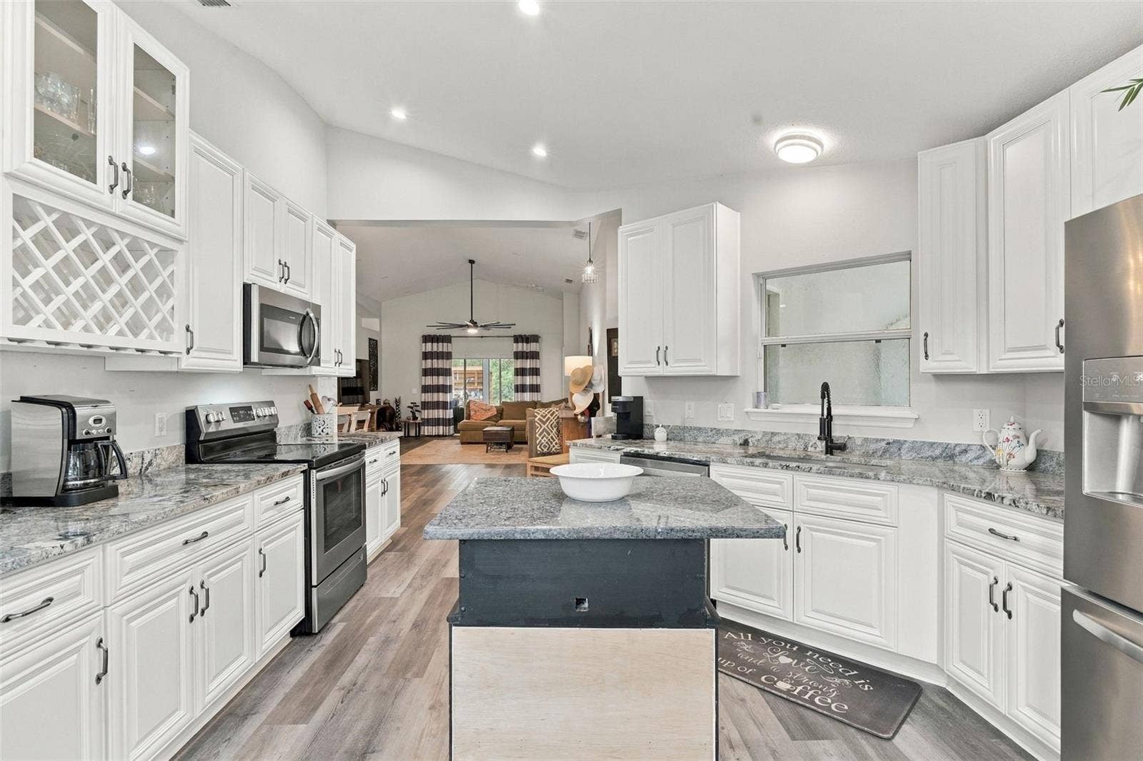 Kitchen from front windows. The lighting is beautiful!