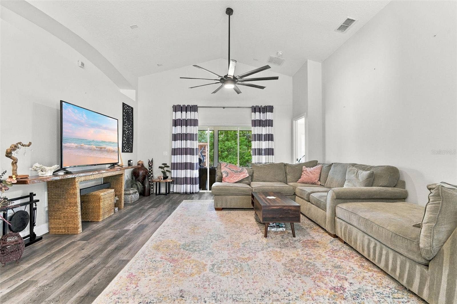 Main living area towards large screened porch.
