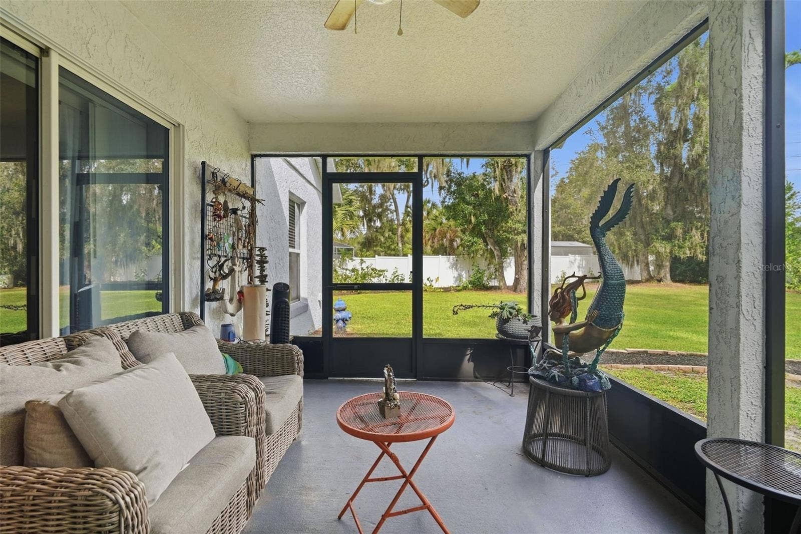 The large screened porch is the perfect place for enjoying life without the bugs.