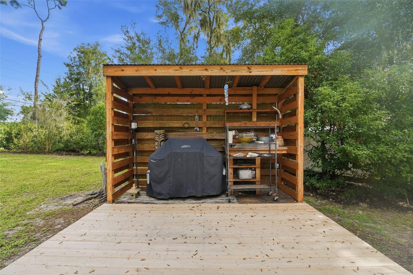 This barbecue patio in the fenced back yard is incredibly nice!