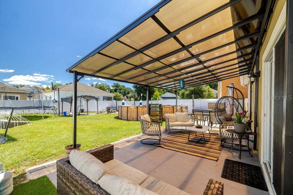 252 SHERRI LEE LANE, Deland, FL 32720 Covered back patio in fully fenced backyard