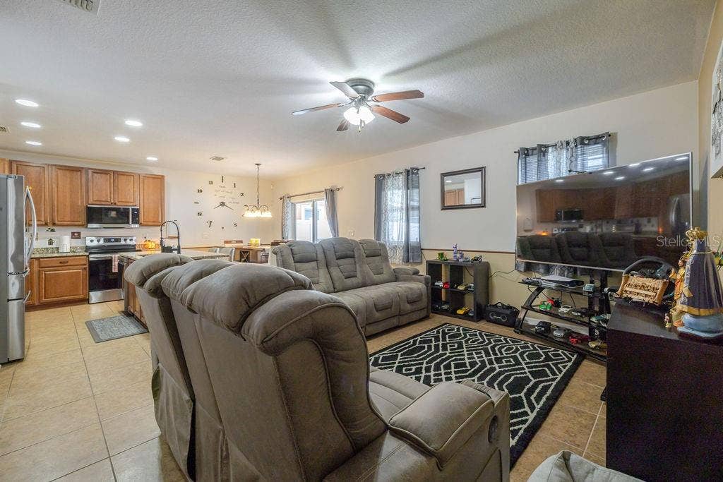 252 SHERRI LEE LANE, Deland, FL 32720 Living room opens to dining room