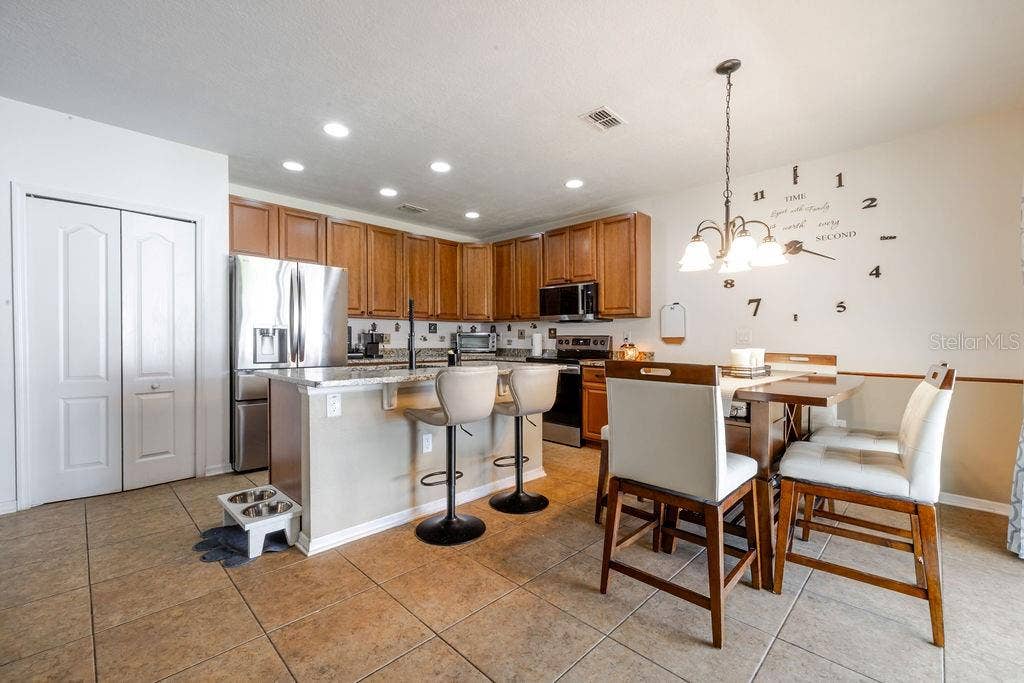252 SHERRI LEE LANE, Deland, FL 32720 Kitchen with large island and dining area