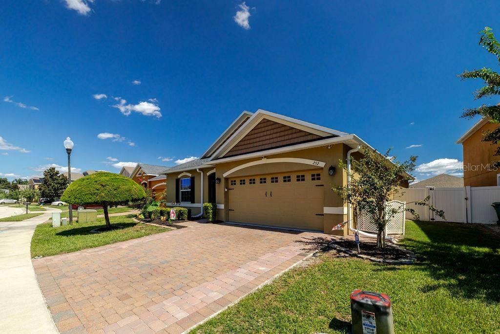 252 SHERRI LEE LANE, Deland, FL 32720 Side view of home with oversized paver driveway