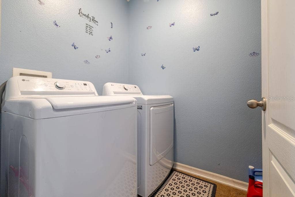 252 SHERRI LEE LANE, Deland, FL 32720 Inside laundry room and washer and dryer convey with home