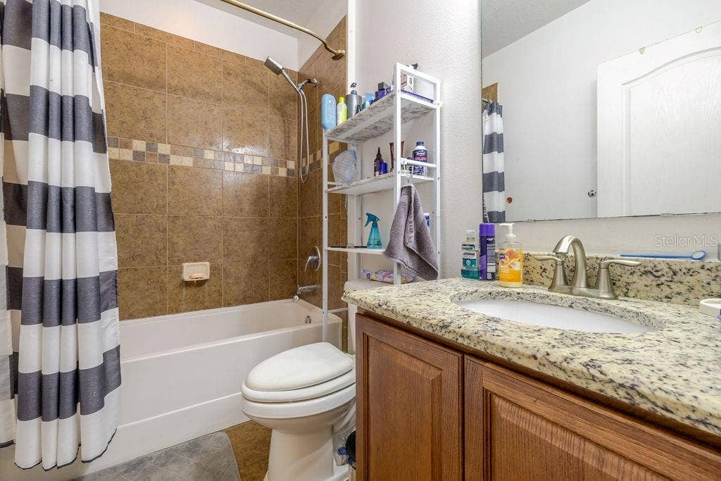 252 SHERRI LEE LANE, Deland, FL 32720 Guest Bathroom with tub and shower