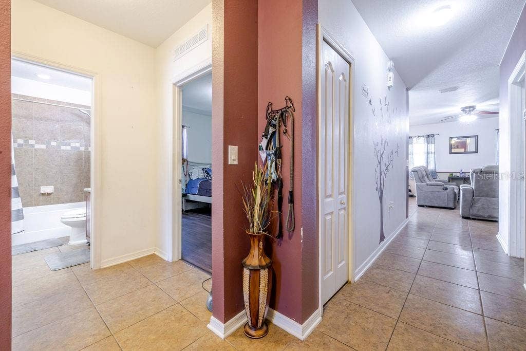 252 SHERRI LEE LANE, Deland, FL 32720 Entrance from foyer. 2 bedrooms and guest bathroom on the left.