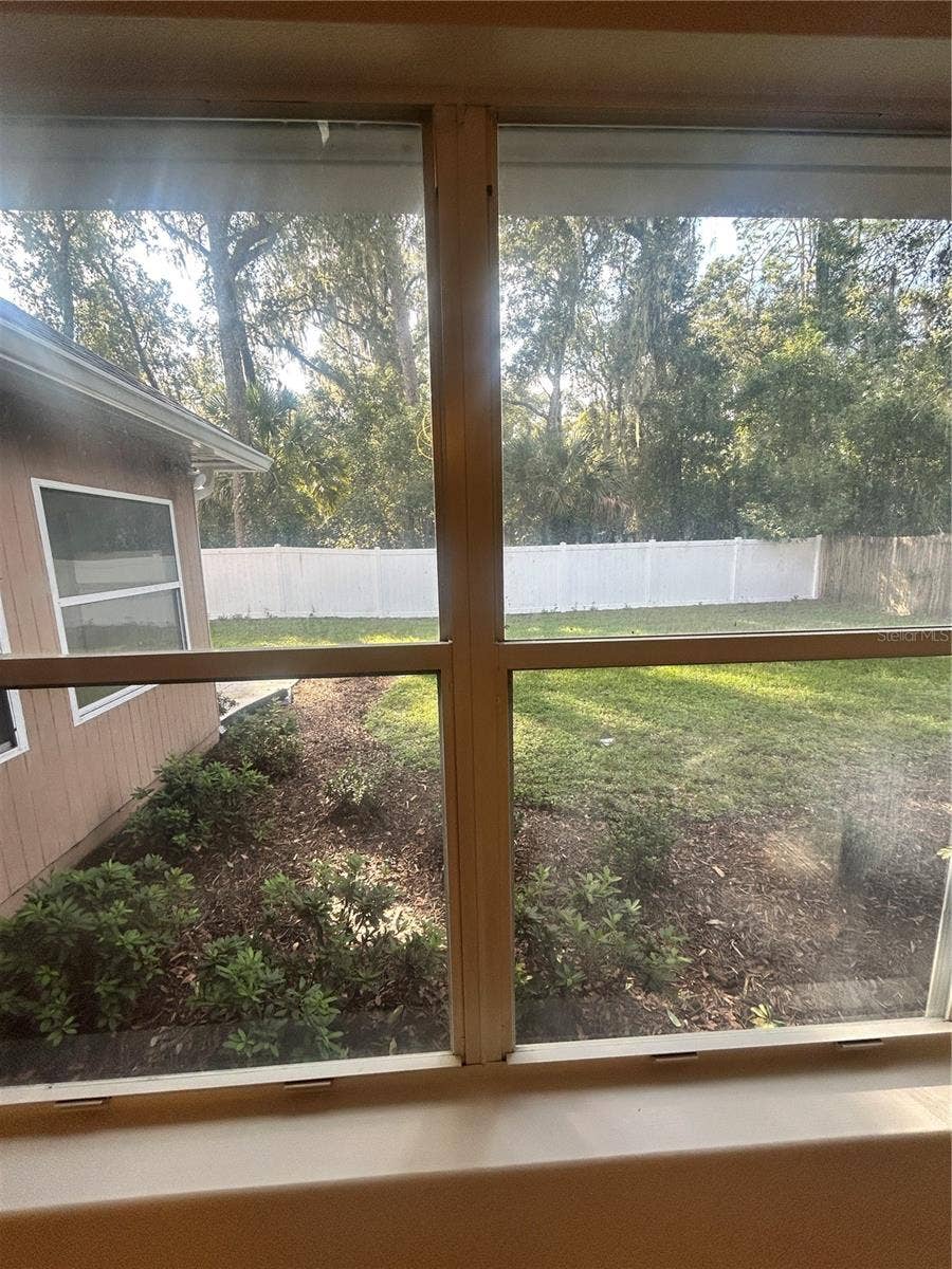 1901 KNOLTON AVENUE, Orange City, FL 32763 DINING ROOM WINDOW VIEW OF GARDEN
