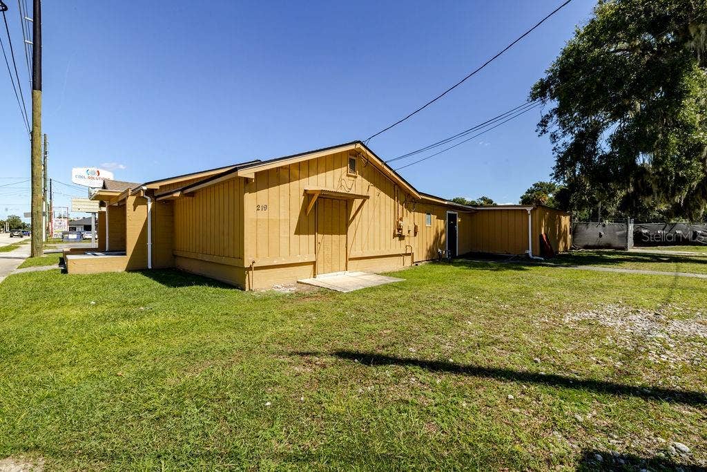 219 S SPRING GARDEN AVENUE, Deland, FL 32720 South side of building.