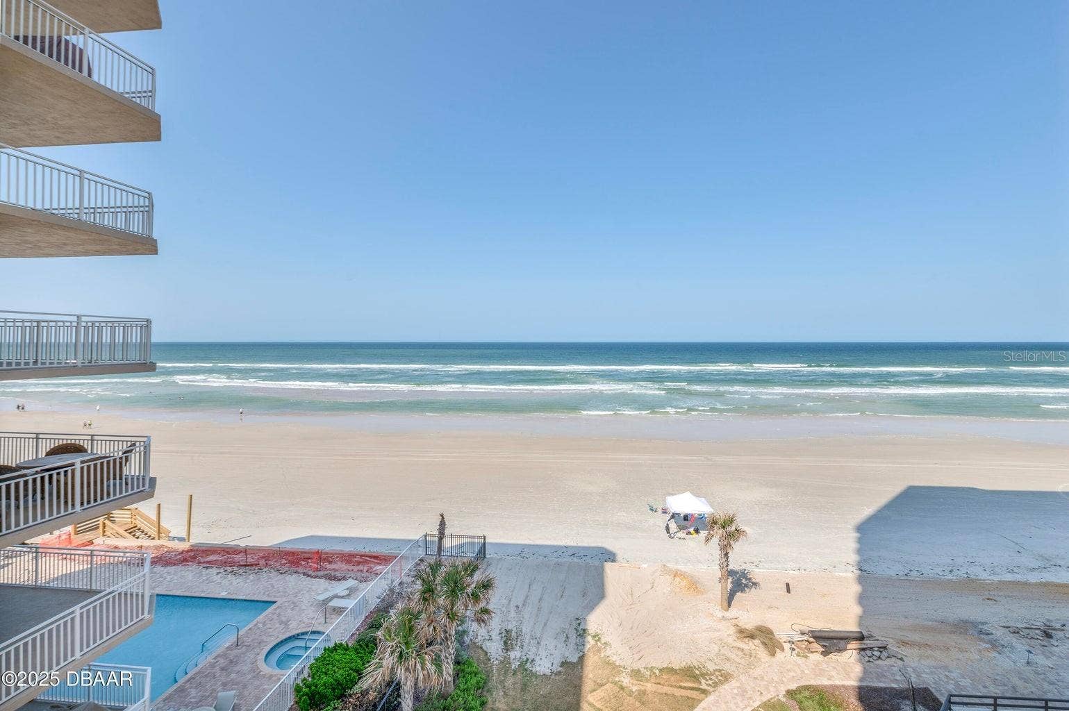 Take in spectacular views of the Atlantic Ocean, sandy shoreline, and rolling waves. The beachfront setting also offers views of the pool area below.
