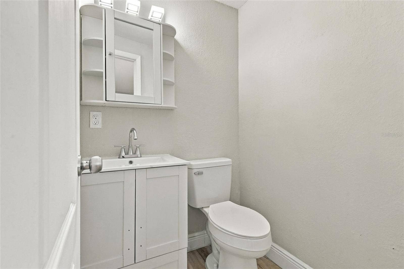 Primary en-suite half bathroom.