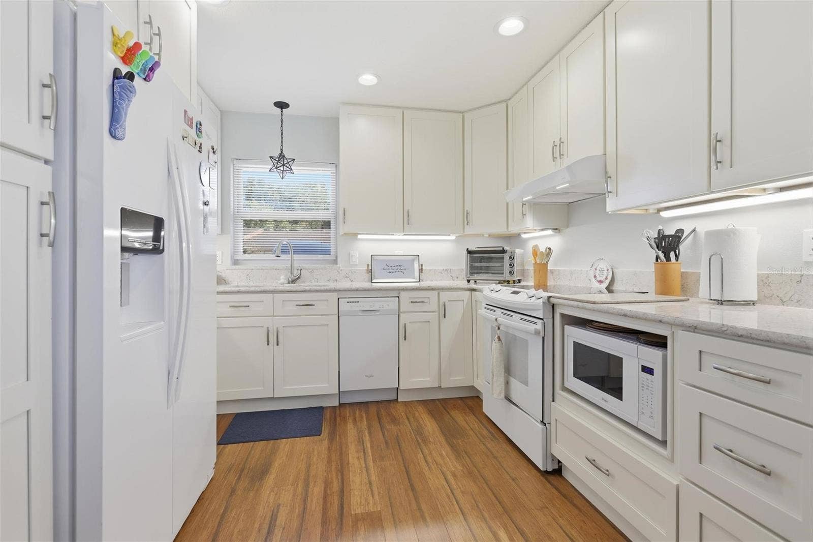 46 VILLA VILLAR COURT, #460, Deland, FL 32724 Full Kitchen with Granite counters and upgraded lighting