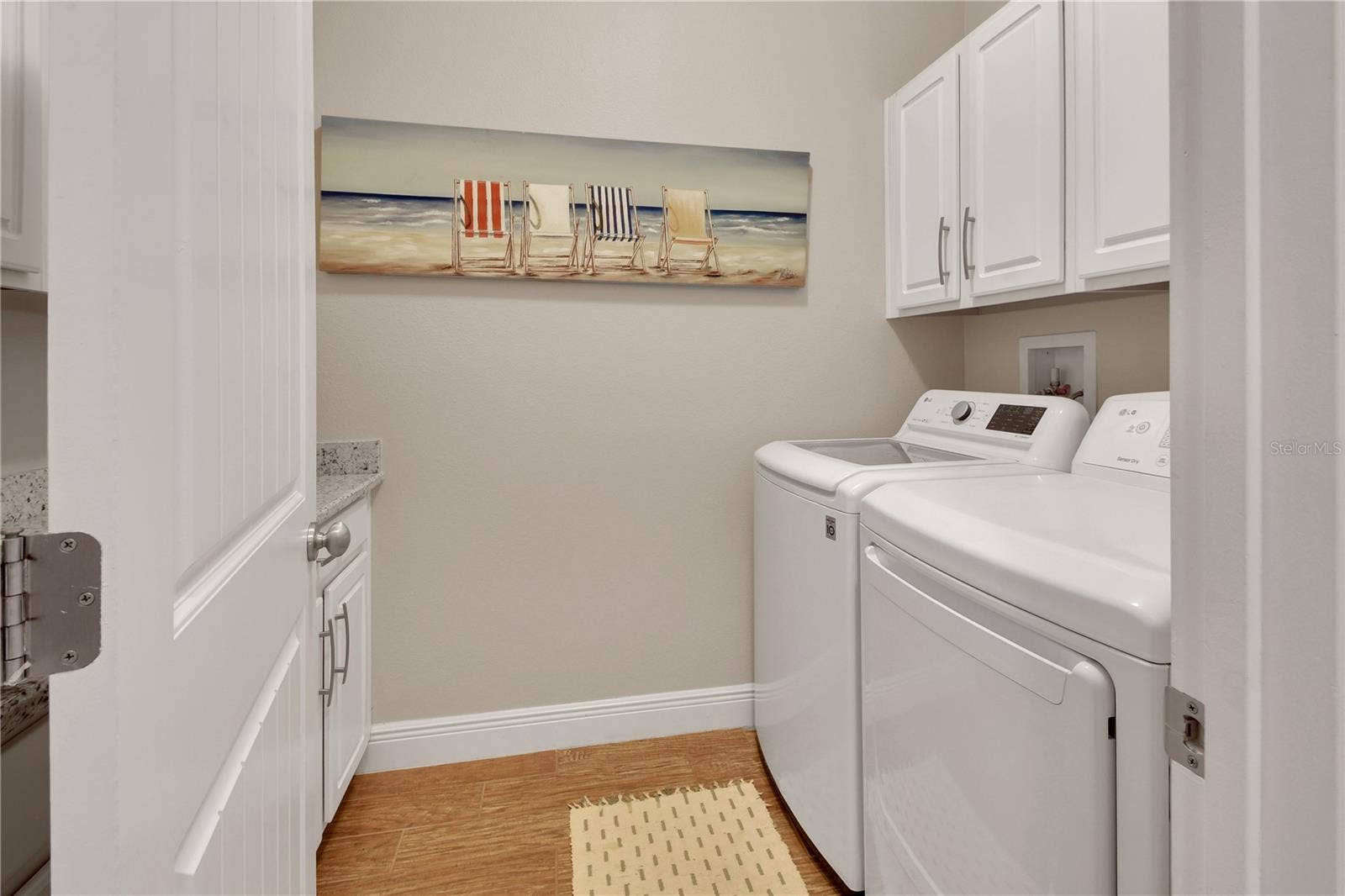 126 MYRTLEBERRY LANE, Deland, FL 32724 Laundry room with tons of cabinets and folding counter