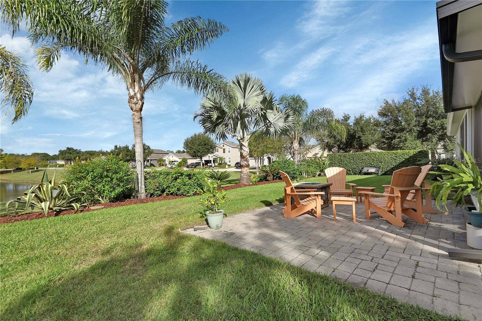 126 MYRTLEBERRY LANE, Deland, FL 32724 Paver patio with water and garden view