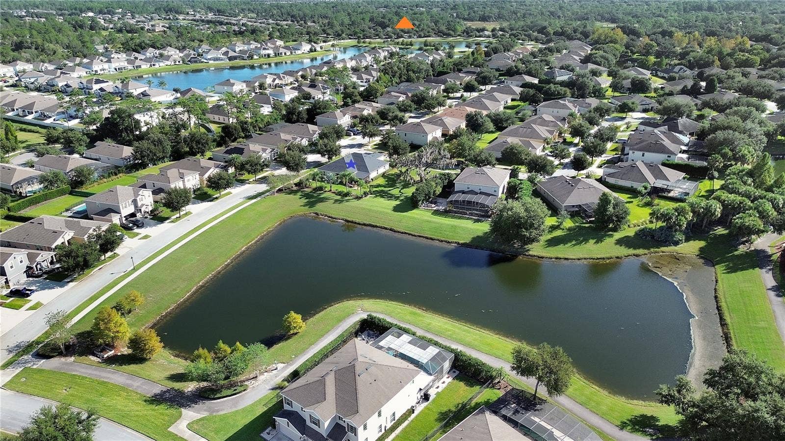 126 MYRTLEBERRY LANE, Deland, FL 32724 Aerial back showing Amenity location with orange triangle