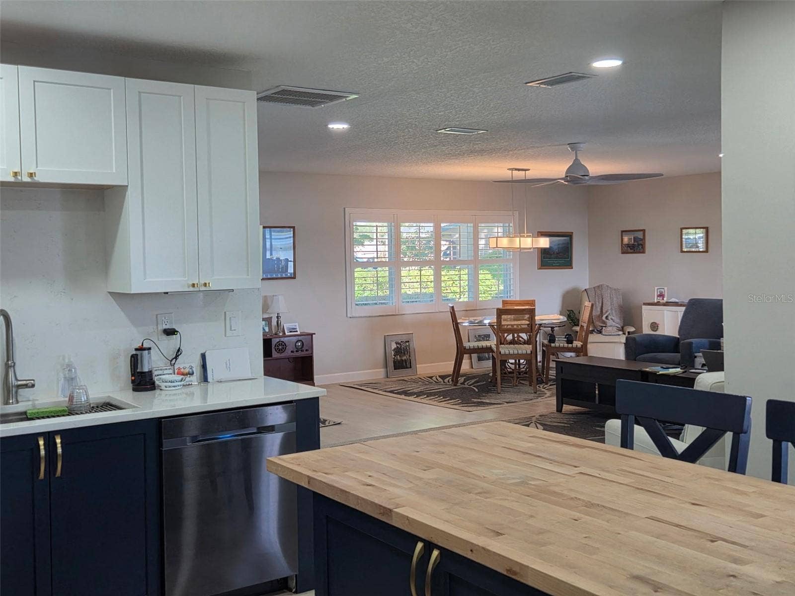 2526 RUSK COURT, Deltona, FL 32738 View of the great room and dining room from the kitchen