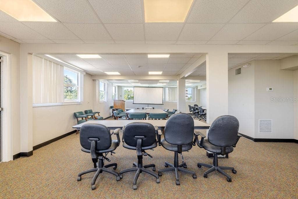 440 S BEACH STREET, Daytona Beach, FL 32114 Third floor conference room and previous sleeping porch, with wrap around windows.