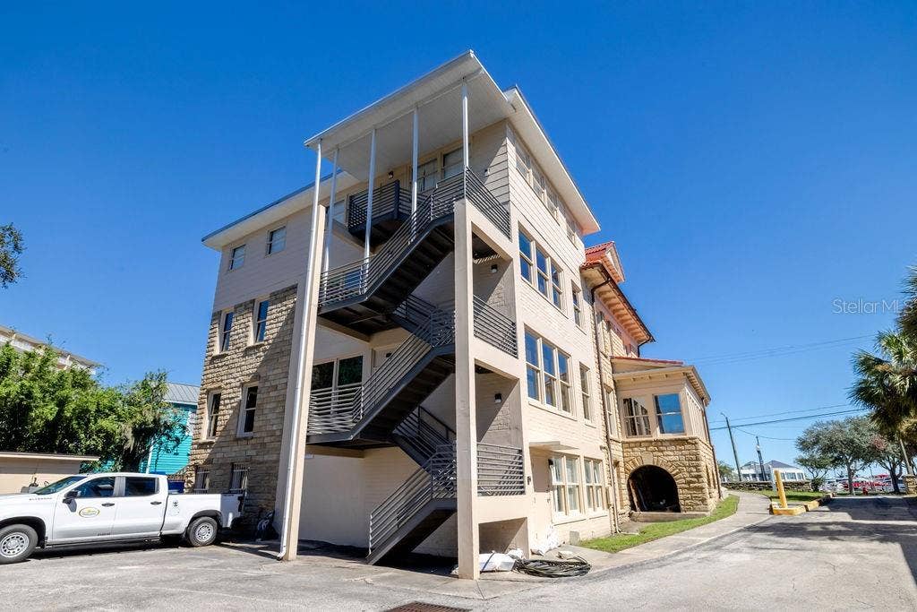 440 S BEACH STREET, Daytona Beach, FL 32114 Newly constructed block and metal fire escape spanning the back of the main building.