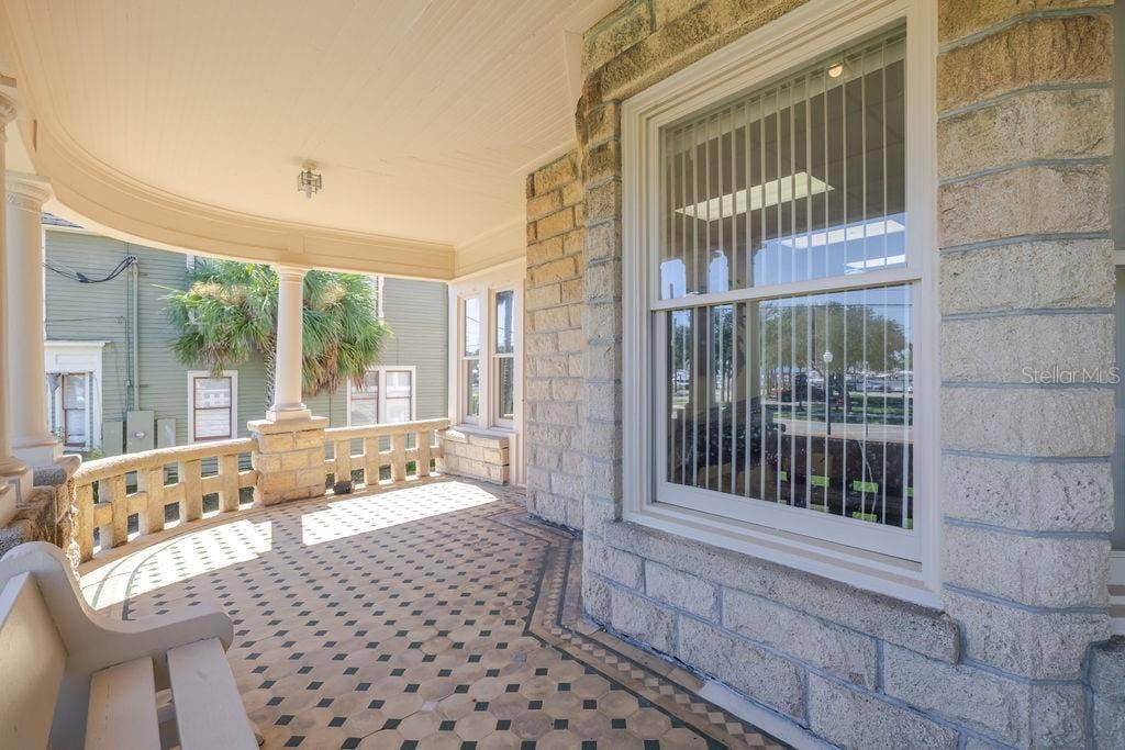 440 S BEACH STREET, Daytona Beach, FL 32114 Oversized historic windows on the front porch.