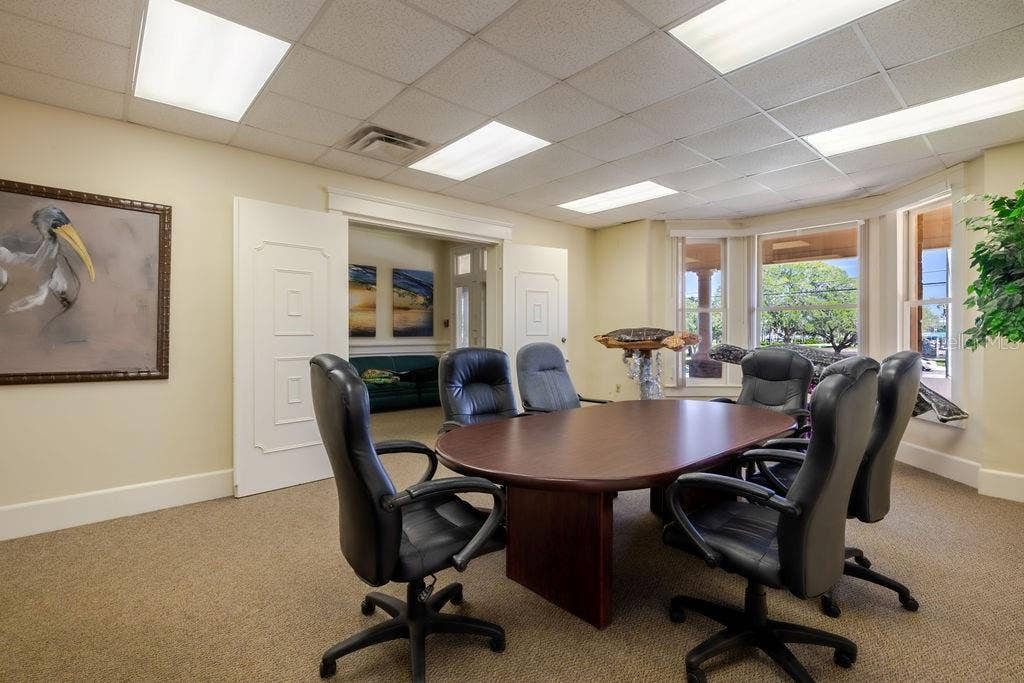 440 S BEACH STREET, Daytona Beach, FL 32114 Conference room and previous living area with beautiful bay window views spanning the Halifax Harbor Marina & Park.