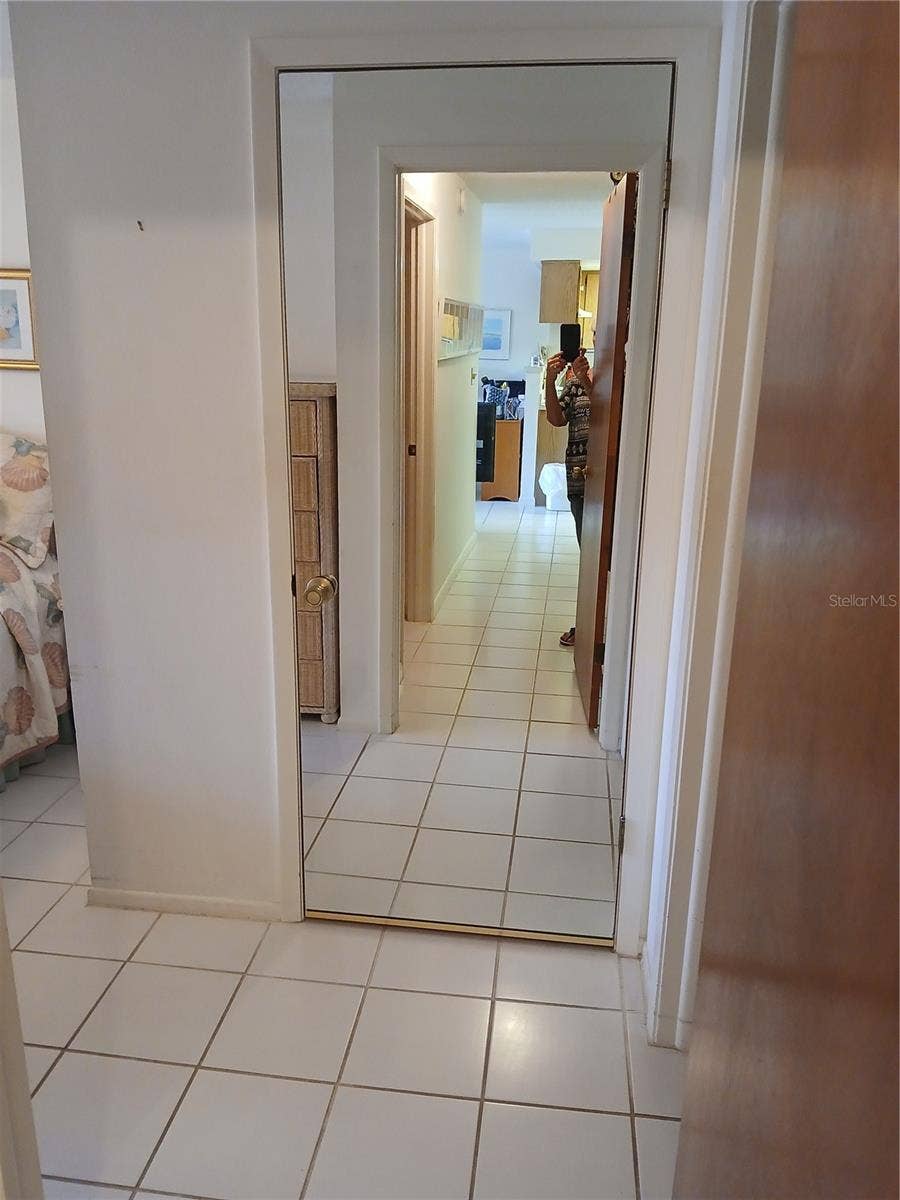 6050 CHESHAM DRIVE, #3, New Port Richey, FL 34653 MASTER BEDROOM MIRRORED CLOSET DOOR