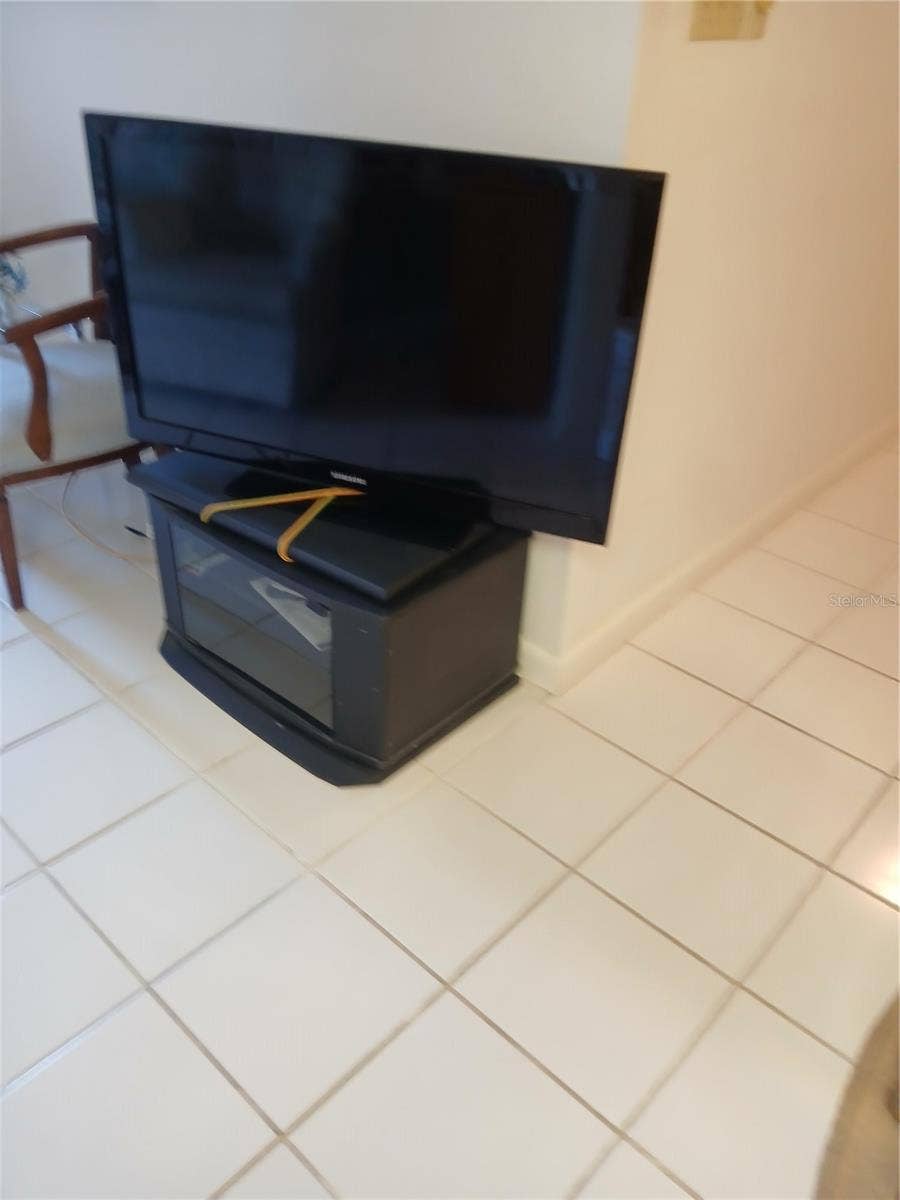 6050 CHESHAM DRIVE, #3, New Port Richey, FL 34653 SAMSUNG TV LIVING ROOM