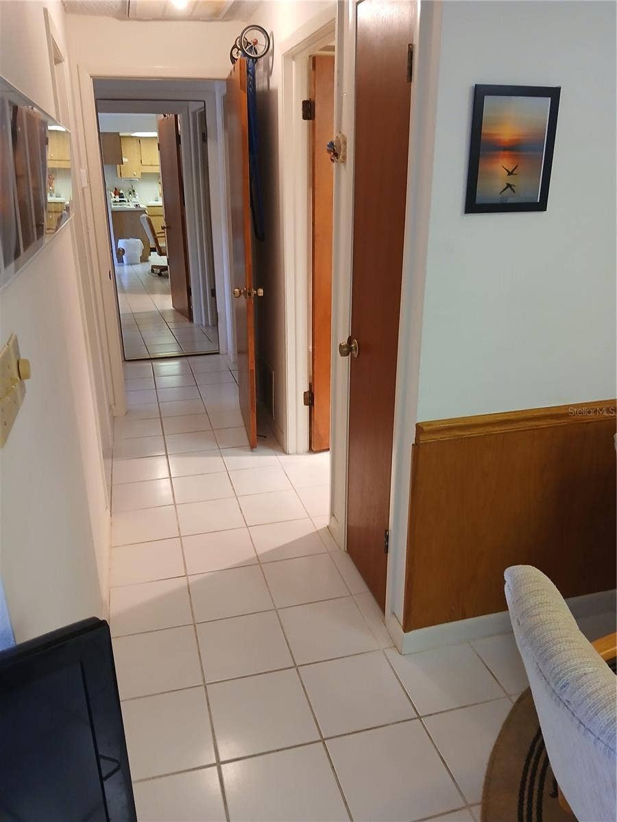 6050 CHESHAM DRIVE, #3, New Port Richey, FL 34653 HALLWAY TO BEDROOMS