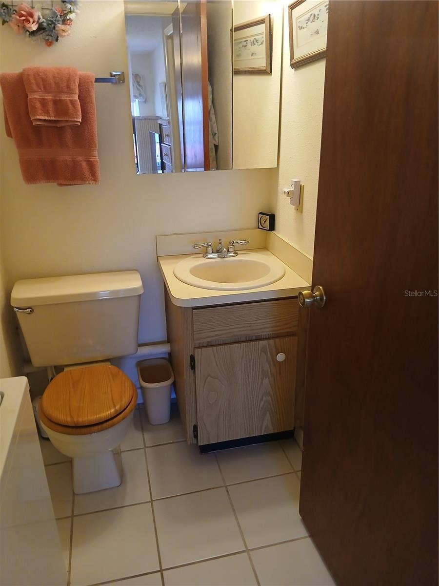 6050 CHESHAM DRIVE, #3, New Port Richey, FL 34653 EN-SUITE HALF BATH