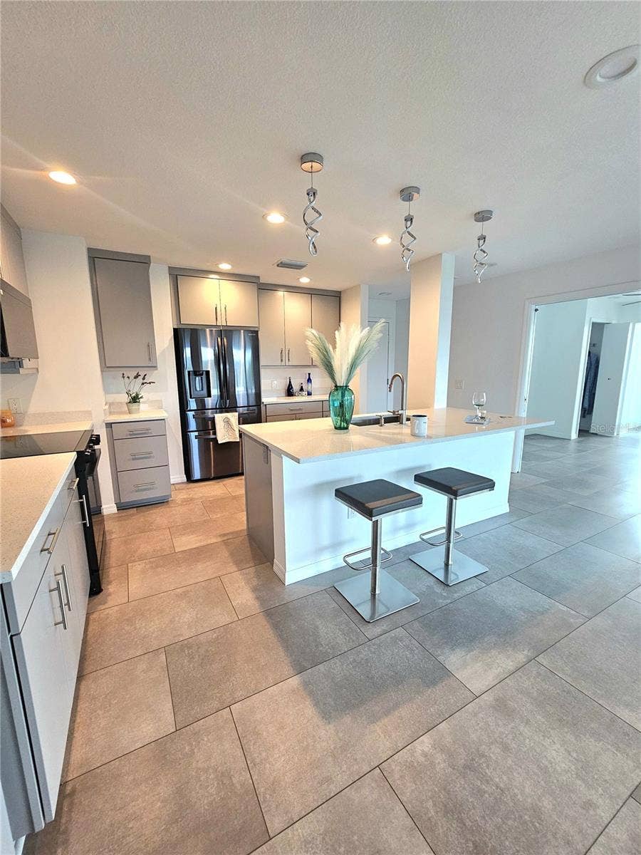 243 MARINER DRIVE, #243, Tarpon Springs, FL 34689 Renovated Chefs Kitchen which Opens to Dining and Living Room