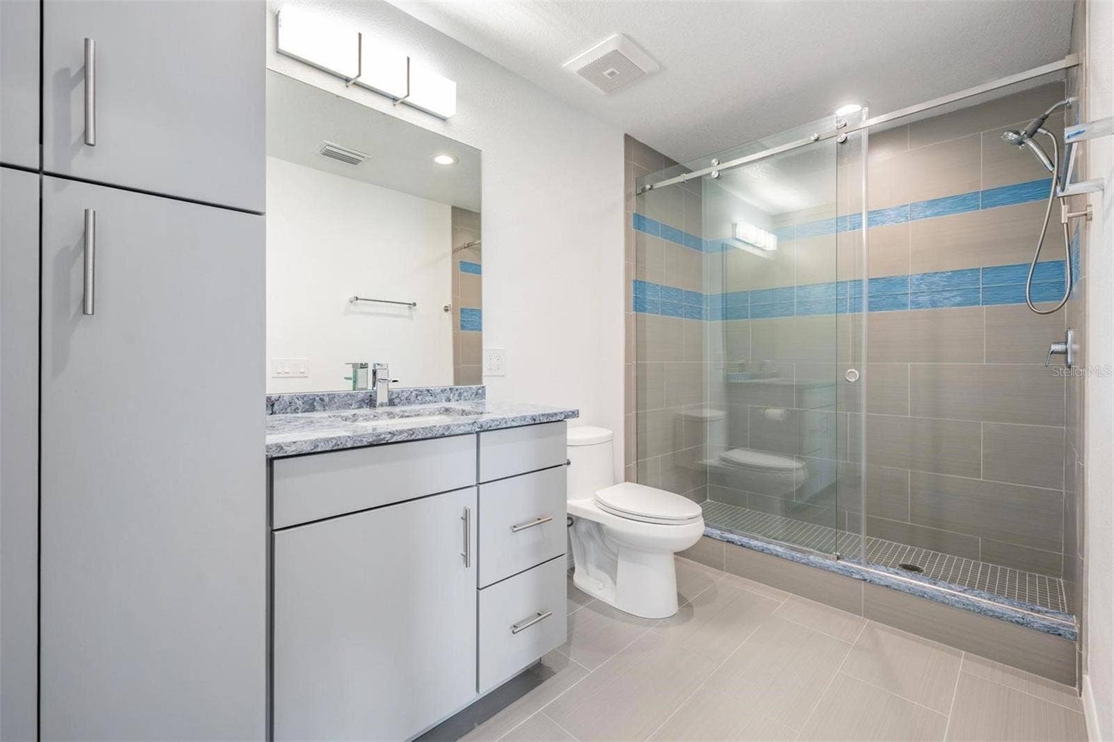 243 MARINER DRIVE, #243, Tarpon Springs, FL 34689 Master #1 Bathroom with Large Shower and Extra Storage