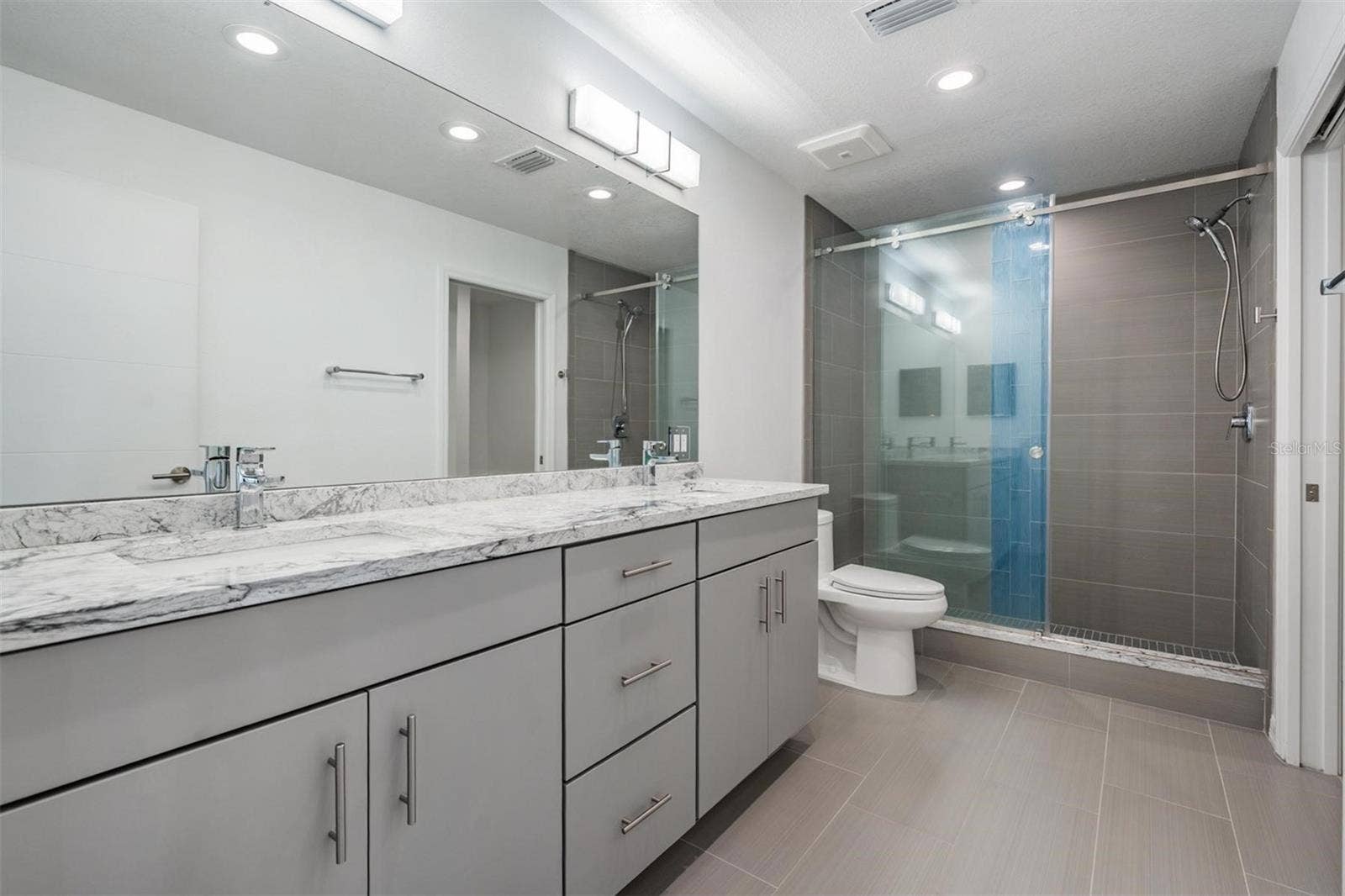 243 MARINER DRIVE, #243, Tarpon Springs, FL 34689 Master #2 Bathroom with Dual Vanities, Large Shower and Storage