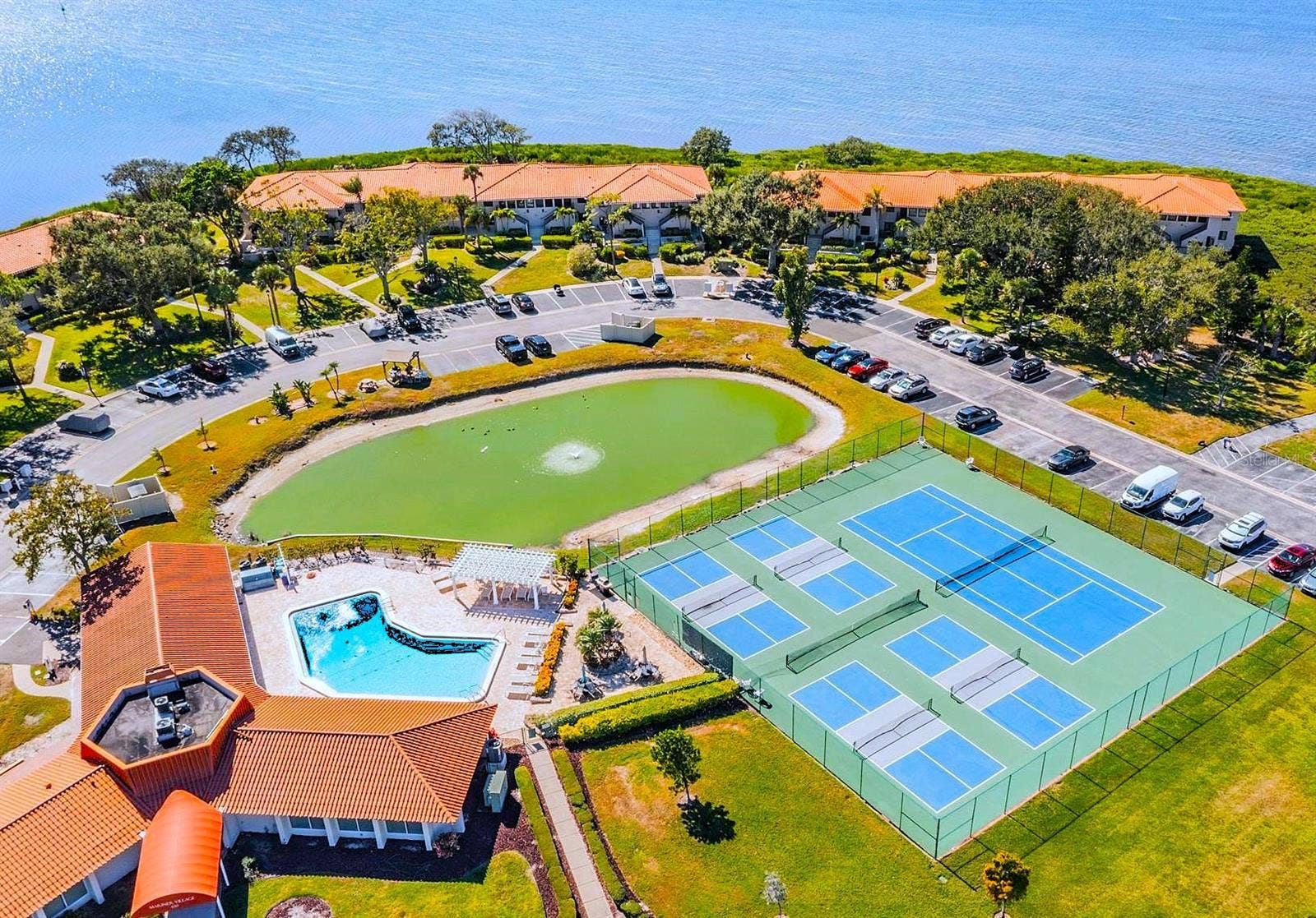 243 MARINER DRIVE, #243, Tarpon Springs, FL 34689 Aerial of Clubhouse, Pool, Pickleball and Tennis Courts