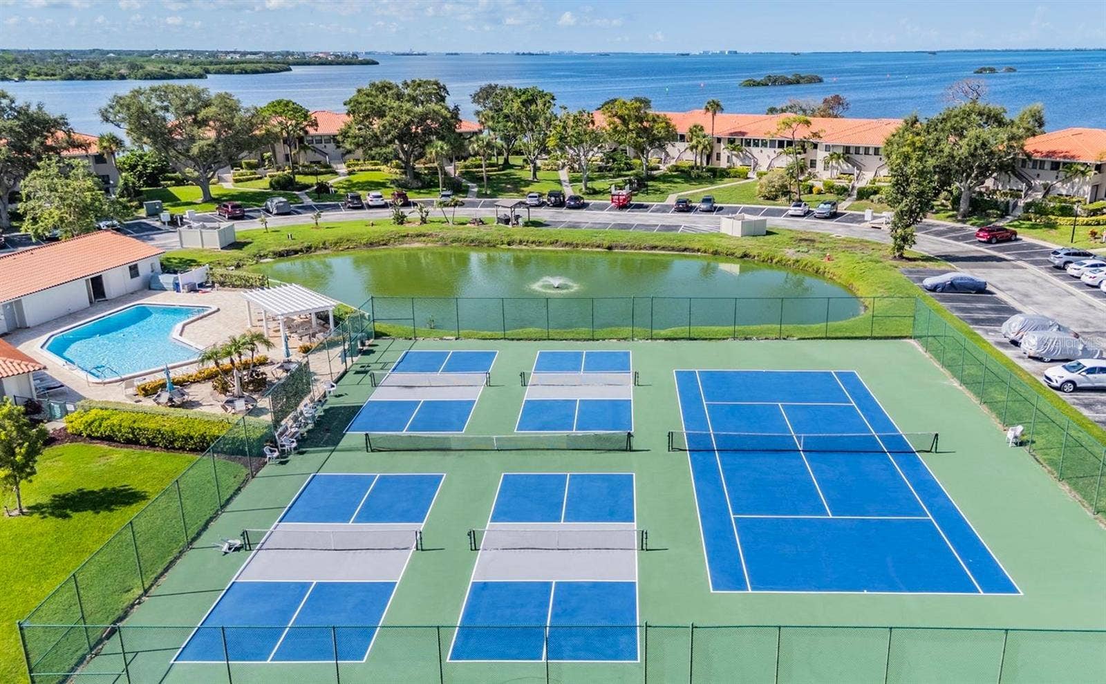 243 MARINER DRIVE, #243, Tarpon Springs, FL 34689 Enjoy Pickleball, Tennis or a Dip in the Pool
