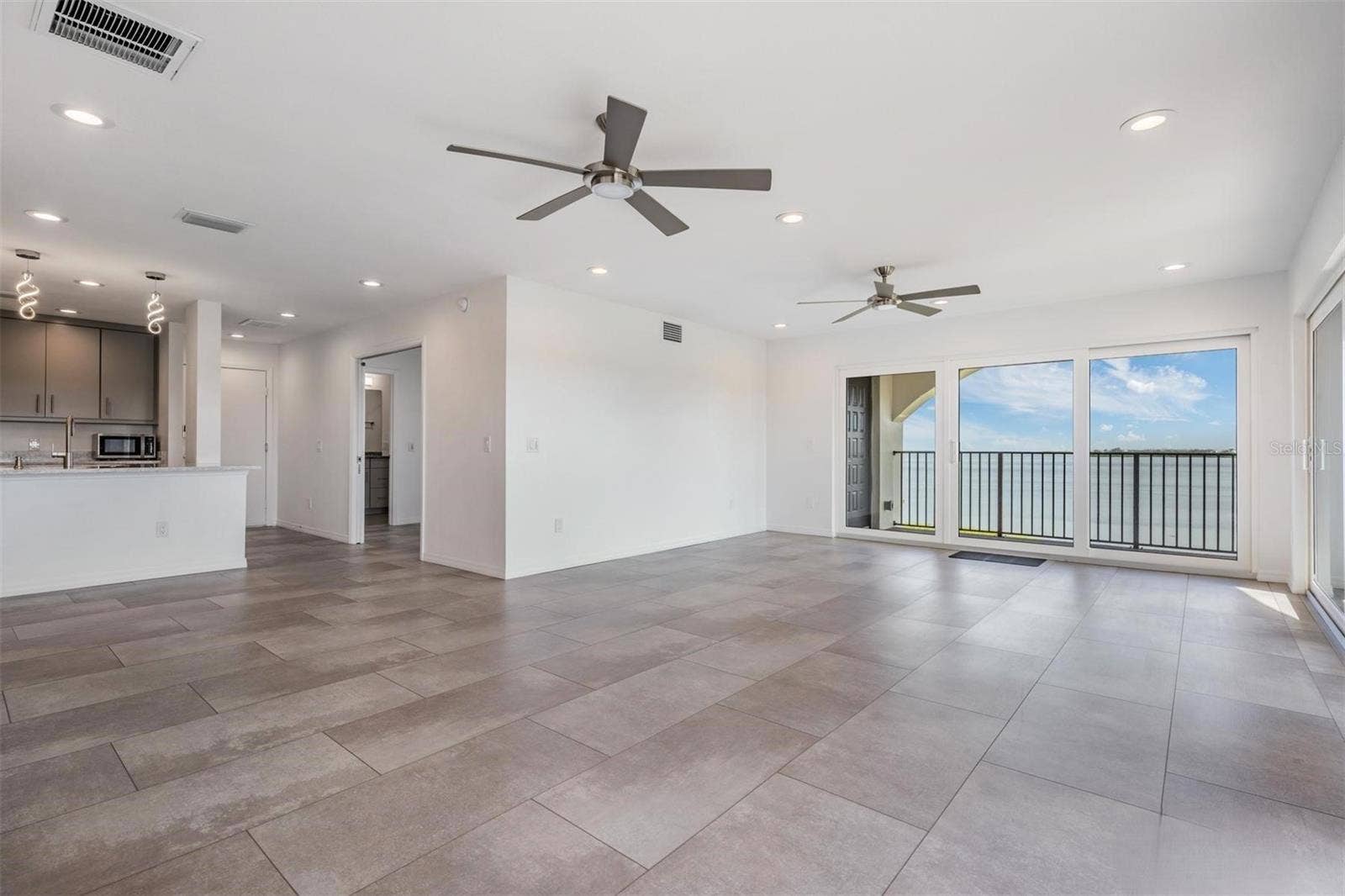 243 MARINER DRIVE, #243, Tarpon Springs, FL 34689 View from Dining Room to Living and Kitchen