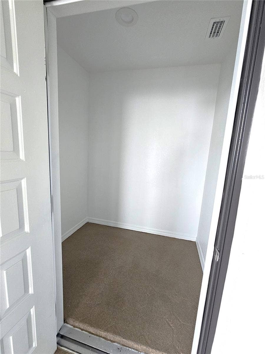 243 MARINER DRIVE, #243, Tarpon Springs, FL 34689 Inside of Air Conditioned Storage on Balcony