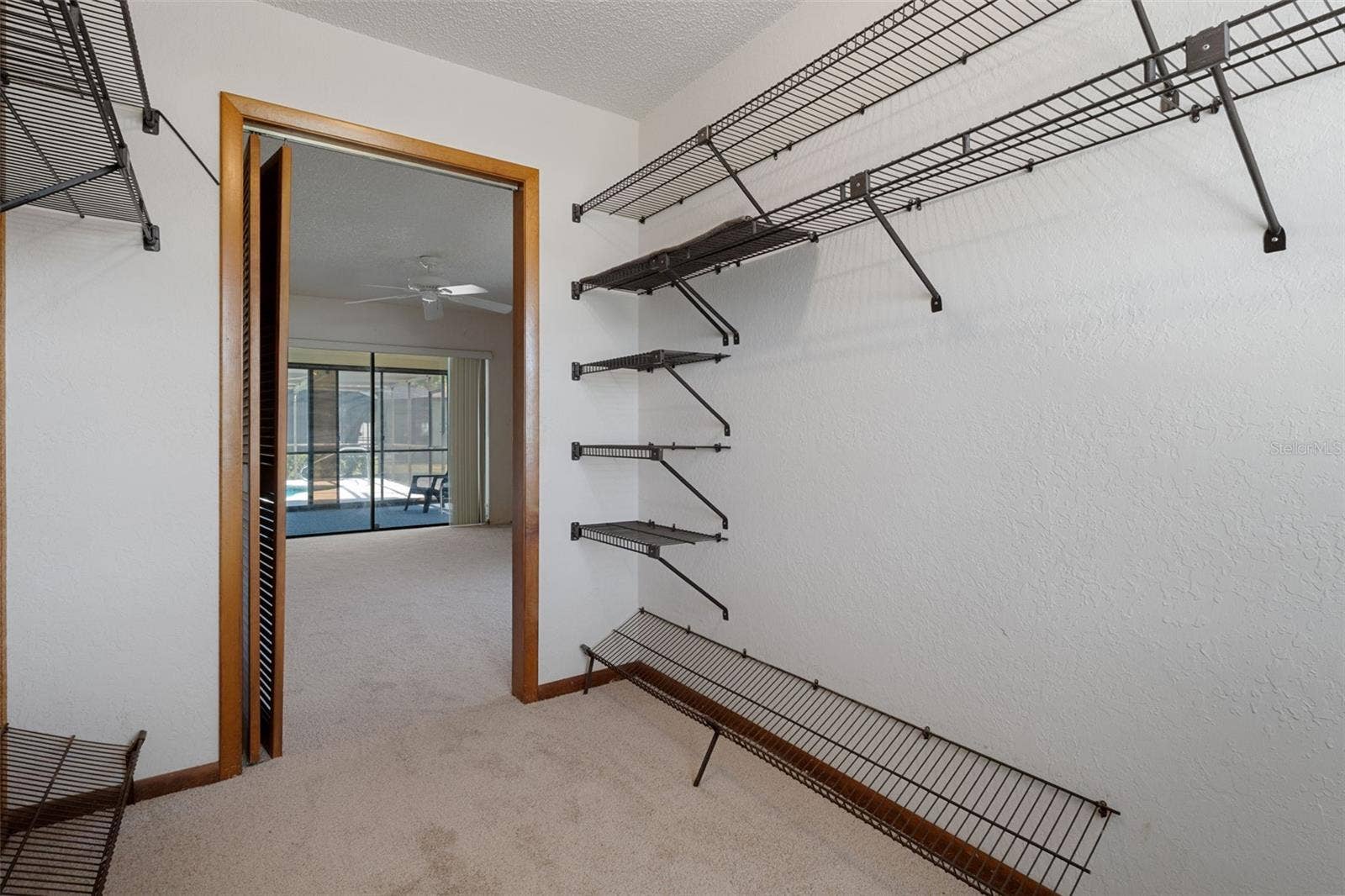 9009 HEATHER BOULEVARD, Weeki Wachee, FL 34613 Master Walk-In Closet