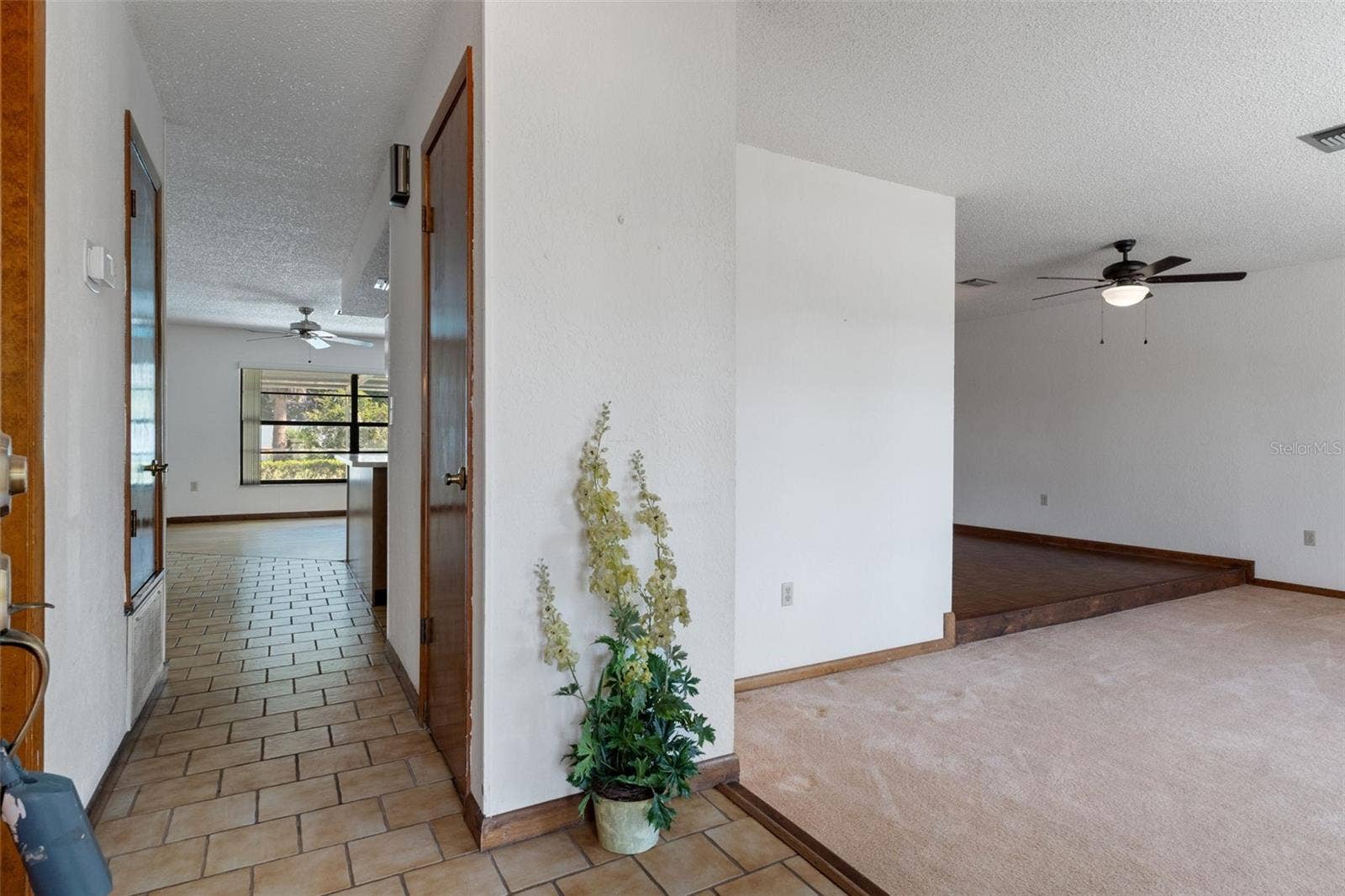 9009 HEATHER BOULEVARD, Weeki Wachee, FL 34613 Formal Living Room is on the right