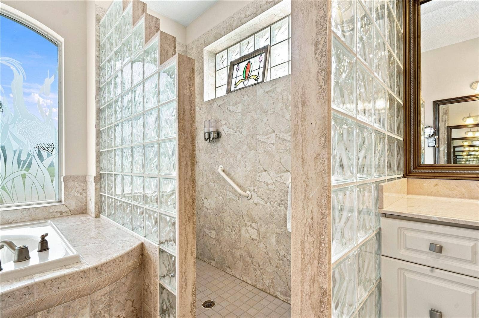 9271 WESTSHORE DRIVE, Weeki Wachee, FL 34613 walk-in shower with tile