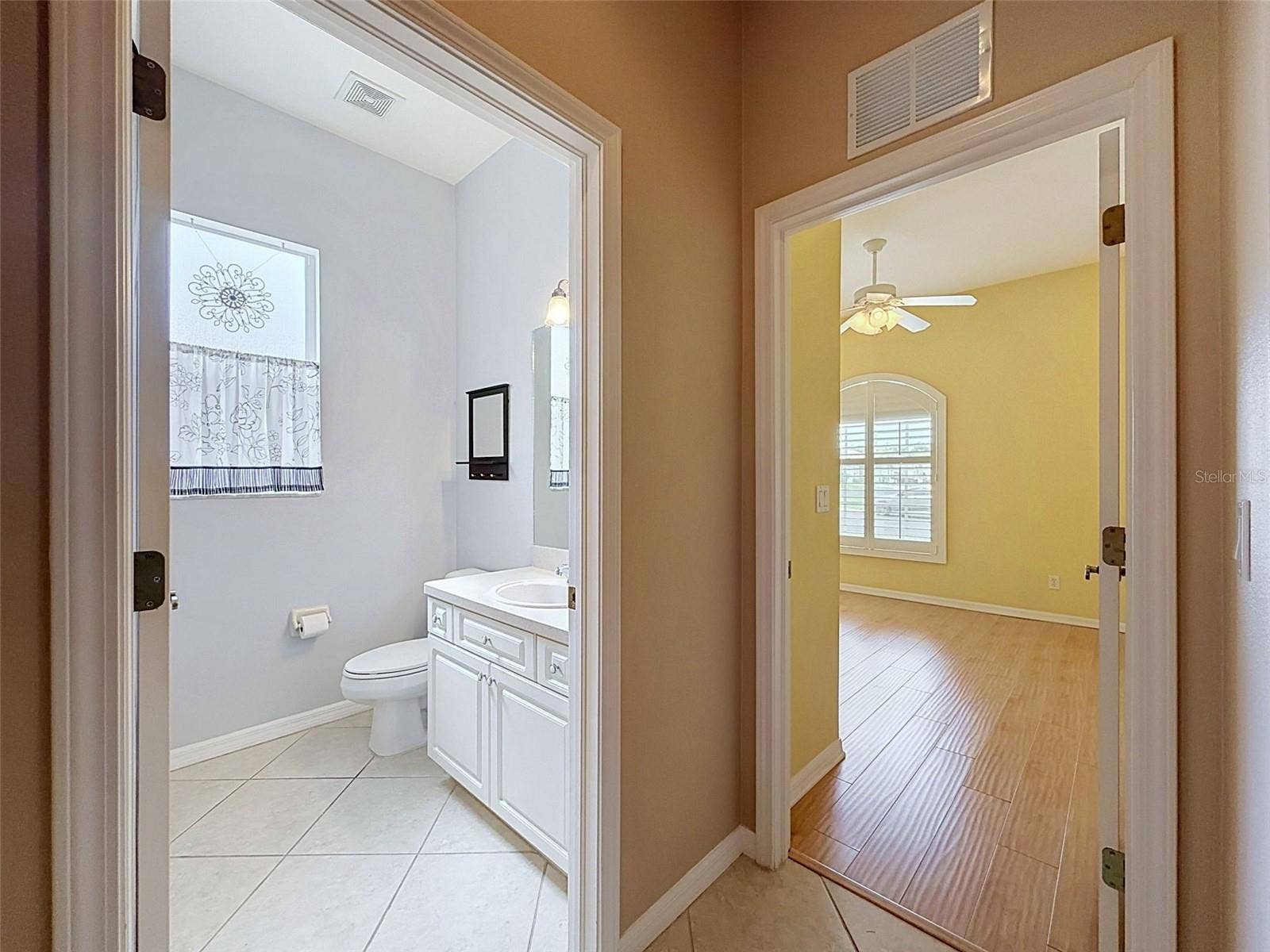 11440 GOLF ROUND DRIVE, New Port Richey, FL 34654 Bathroom 2 with view of hall and Bedroom 3