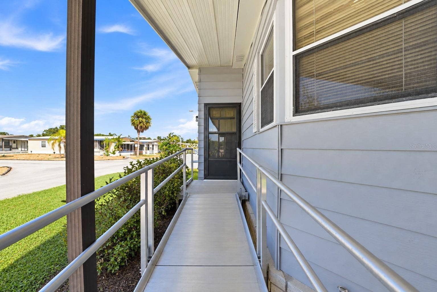 Front door entrance via aluminum ramp
