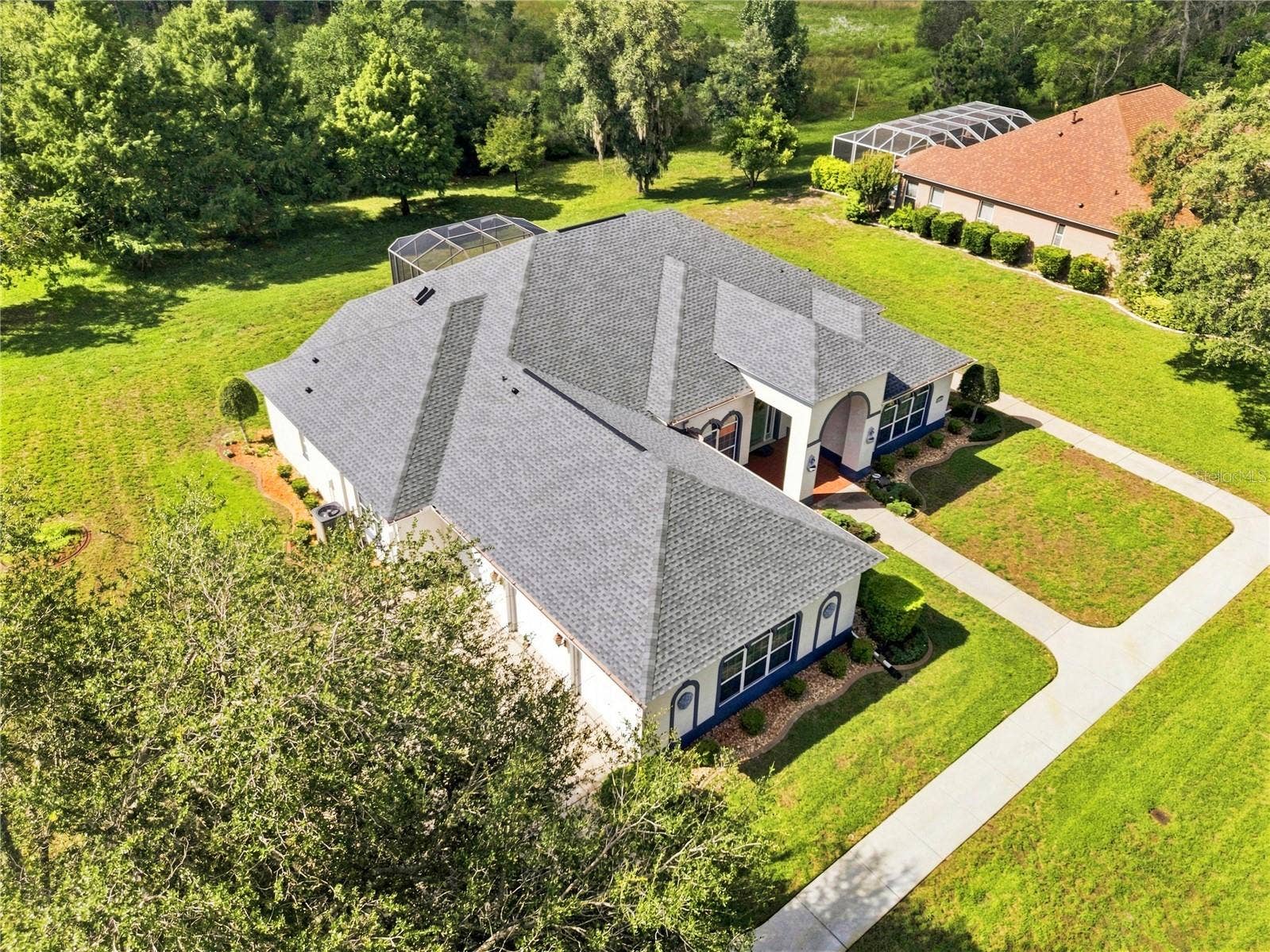 8698 MISSISSIPPI RUN, Weeki Wachee, FL 34613 Living room into breakfast area nook eat in kitchen , wood flooring & Tile flooring