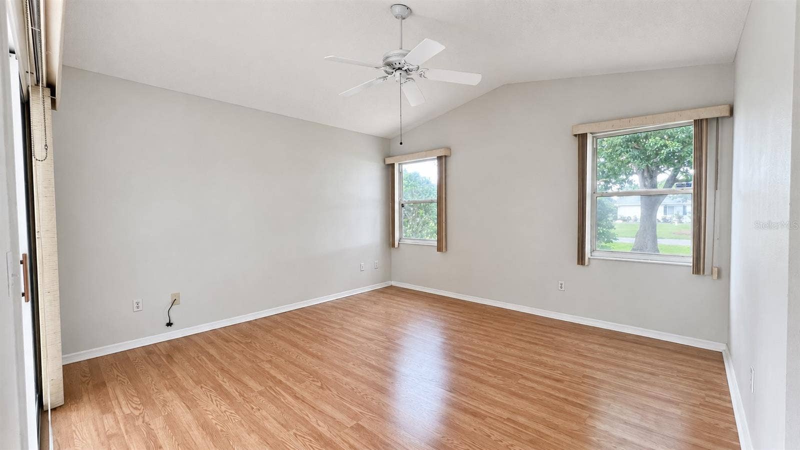 6501 SW 84TH PLACE ROAD, Ocala, FL 34476 Master bedroom facing the side and lanai features large WIC and bath.