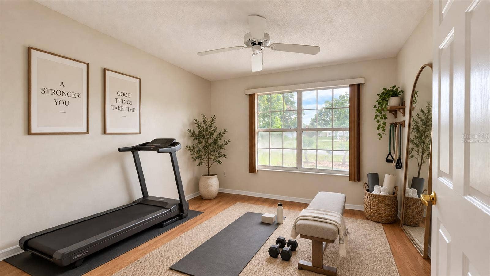 6501 SW 84TH PLACE ROAD, Ocala, FL 34476 2 of 3 total bedrooms. Virtually staged as a home gym here.